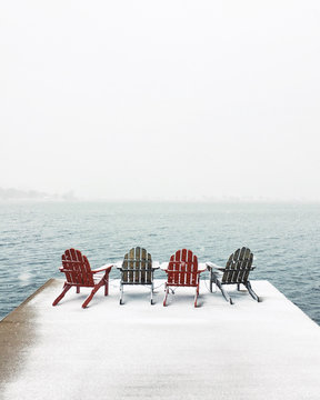 Wooden chairs placed on dock