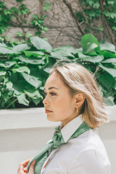 Direct view of young woman posing in park
