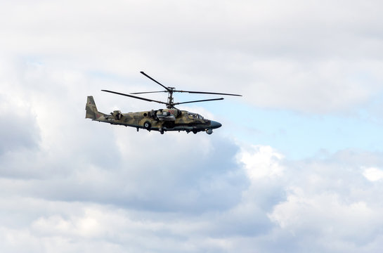 Russian Air Force Mi-28 Havoc military attack combat helicopter in camouflage flying against cloudy sky