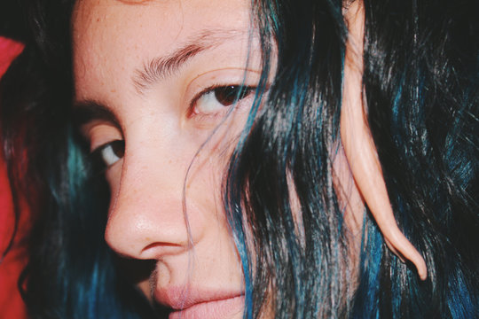 Close up of woman with strands of hair over face
