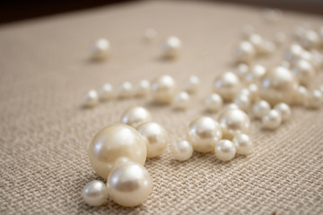 Bunch of multi size pearls on a background.Glamorous pearls milky-way.luxury lifestyle.Holiday decoration.Nice and shiny romantic morning.Love and success.