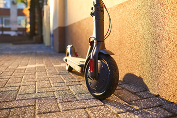 Electric scooter on a background of a wall © Studio Romantic