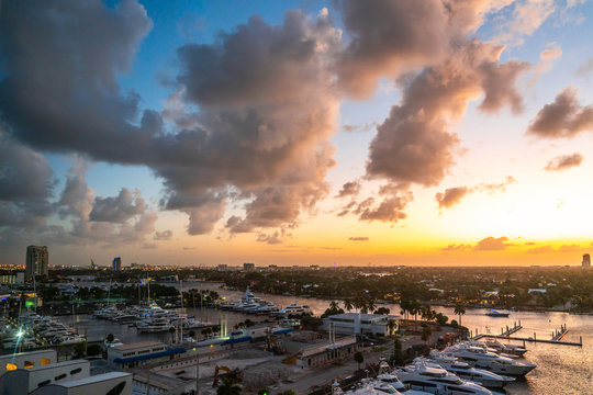 Aerial view of Fort Lauderdale waterway canals, residential homes and skyline at sunset