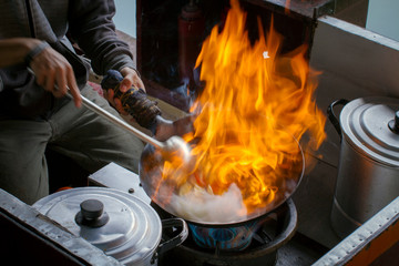 Cooking flame on the top of a wok