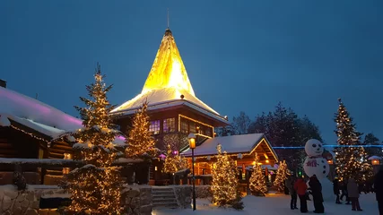 Foto op Canvas Evening Winter in Santa Claus Village. Rovaniemi behind the Arctic circle, Lapland, Finland © Khrystsina