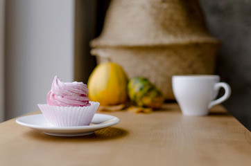 Pink marshmallow with pumpkin in coffee shop.