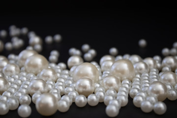 Bunch of multi size pearls on a background.Glamorous pearls milky-way.luxury lifestyle.Holiday decoration.Nice and shiny romantic morning.Love and success.