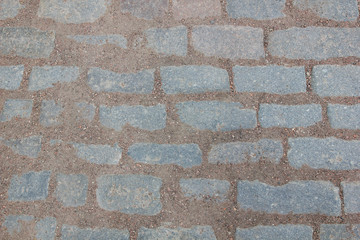 The texture of the floor is made of stones held together by earth and crumbs of fine gravel