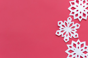 Red background with blank space and three white snowflakes