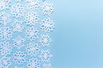 Christmas winter greeting card with white snowflakes and blank space