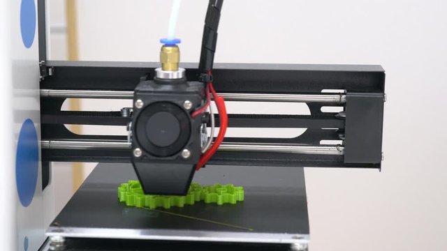 3D printer printing an object from plastic. 3d printer in action.