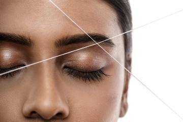 Eyebrow threading - epilation procedure for brow shape correction