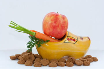 Wooden shoe with carrot and pepernoten. Symbol of Dutch feast called Sinterklaas.