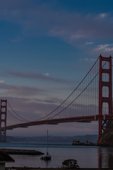 Golden Gate Bridge seen from Fort Baker under a cloudy sky before sunrise