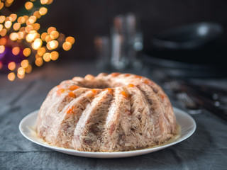 Homemade delicious jelly meat on festive Christmas table. Perfect jellied meat, aspic, galantine...