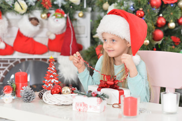 Close up portrait of cute smiling girl with gift