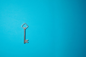 Key on blue background. Minimal creative style