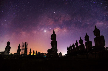 Milky way galaxy with buddha stature landscape nature dark filter style