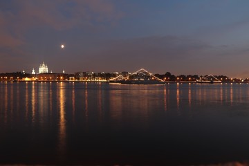 Fototapeta na wymiar illuminated warships on the river at night