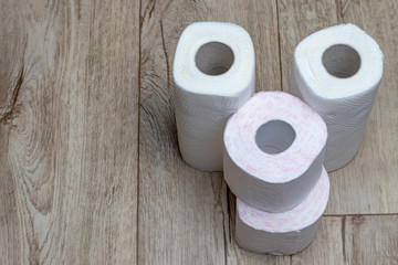 wooden background. toilet paper and some paper towels. close-up.