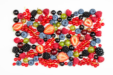 Strawberry, blueberry, blackberry, gooseberries, raspberry, currants on white background, top view. Berries texture. Pattern of fresh summer berries on white background. Creative food concept