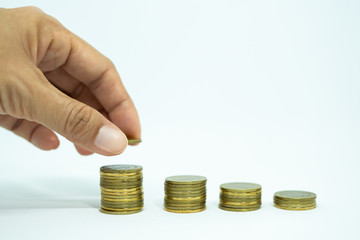 Female hand put coin stack on money. Business growing concept,  Saving money concept