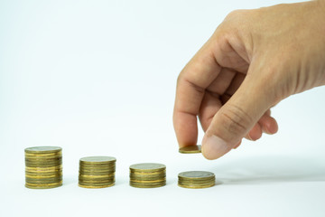 Female hand put coin stack on money. Business growing concept,  Saving money concept