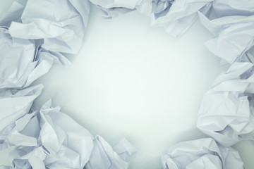 Crumpled white paper is mauled on white blackground with copy space. ideas concept