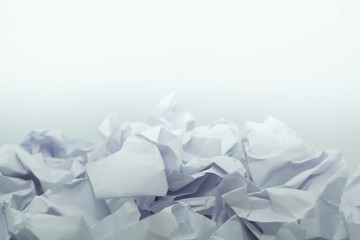 Crumpled white paper is mauled on white blackground with copy space. ideas concept