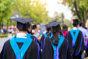 Blurred image back side view a group higher education graduation of graduates during commencement. Congratulation in University concept, Education concept.