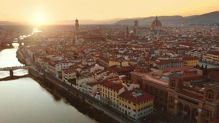 Aerial Drone View: Historically and Culturally Rich Italian Town on the Sunny Day. Beautiful Old City With Medieval Churches and Cathedrals. River Runs through the City