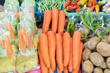 Various vegetables on the counter. organic fresh fruits and vegetables on grocery counter. Selling vegetables in Asia.
