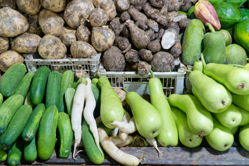 Various vegetables on the counter. organic fresh fruits and vegetables on grocery counter. Selling vegetables in Asia.