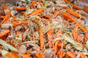 Food as texture. Closeup of a noodles vegetable salad.
