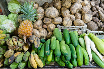 Various vegetables on the counter. organic fresh fruits and vegetables on grocery counter. Selling vegetables in Asia.