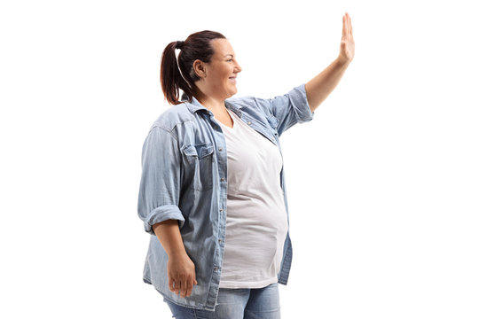 Corpulent young woman making a high-five gesture