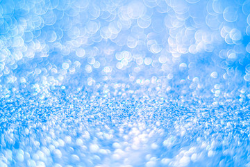 Glitter light abstract blue bokeh blurred background