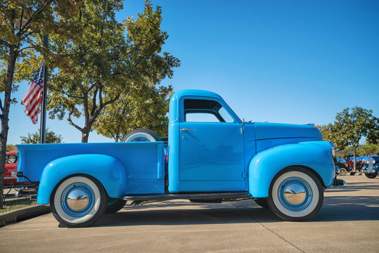 Full side view of a light blue color vintage Studebaker pickup truck classic car on October 19, 2019 in Westlake Texas.