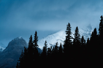 Dramatic light with silhouette of mountains 