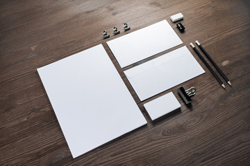 Blank corporate stationery set on wood table background. Corporate identity template. Responsive design mockup.