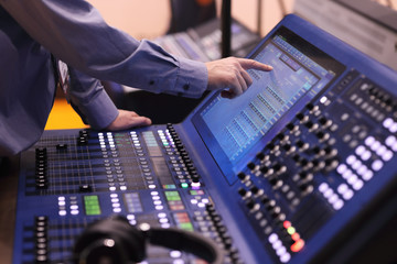 operator working with digital mixing console