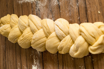 Yeast dough is prepared for a yeast plait and laid in length
