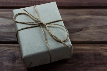 gift box in the dark on wooden background
