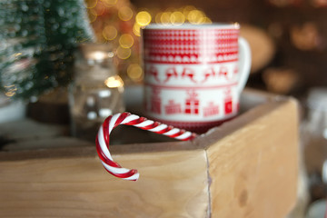 Christmas candy on the background of Christmas mug, Christmas mood