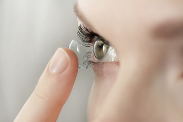 girl wearing soft contact lenses close-up macro