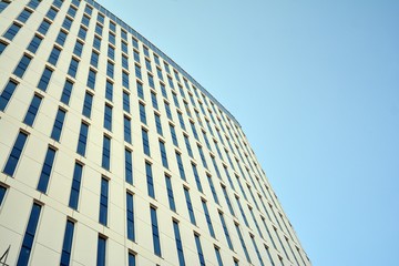 Panoramic and perspective wide angle view to steel light blue background of glass office building commercial modern city of future. Business concept of success industry tech architecture. 