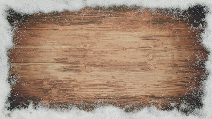 Rahmen mit Schnee Schneeflocken auf rustikaler Holztextur - Winter/Schnee Hintergrund 