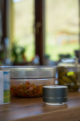 Smart ai speaker with woman cooking in the background. Smart home concept