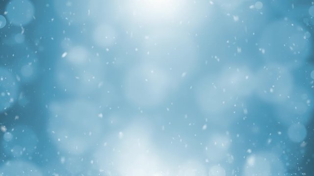Shining blue blurry circle bokeh with falling snowflakes. Copy space animation background.