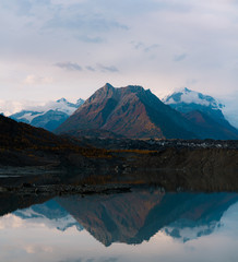 Alaskan mountains with glaciers and snow caps in autumn season during sunset